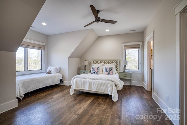 bedroom with dark hardwood / wood-style flooring and ceiling fan