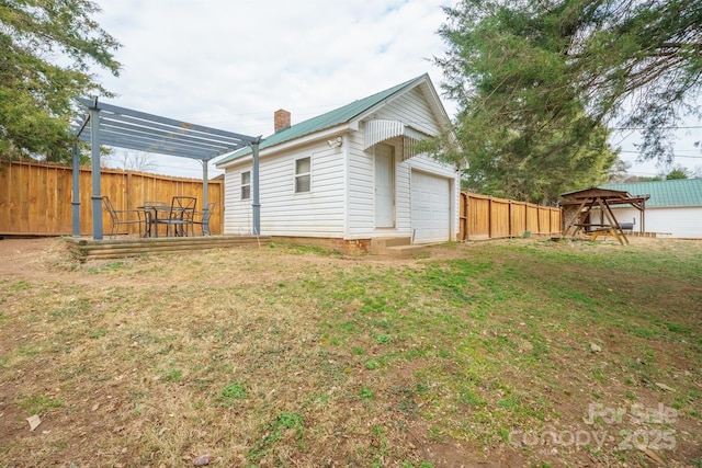 exterior space featuring an outbuilding and a garage