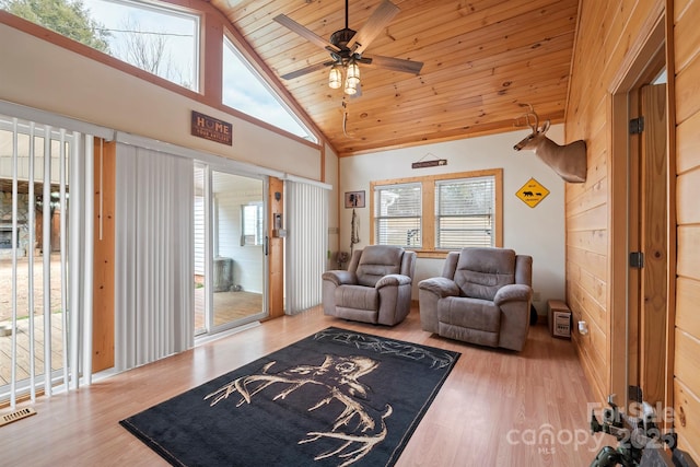 living room featuring high vaulted ceiling, wood-type flooring, wooden ceiling, and ceiling fan