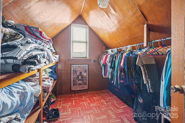 walk in closet featuring vaulted ceiling