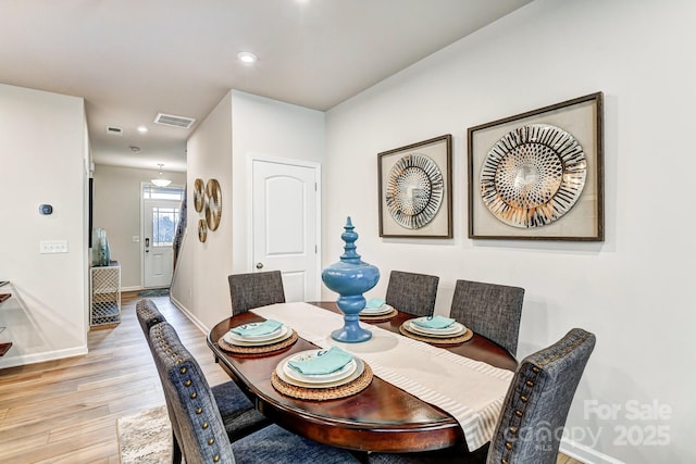 dining area with light hardwood / wood-style floors