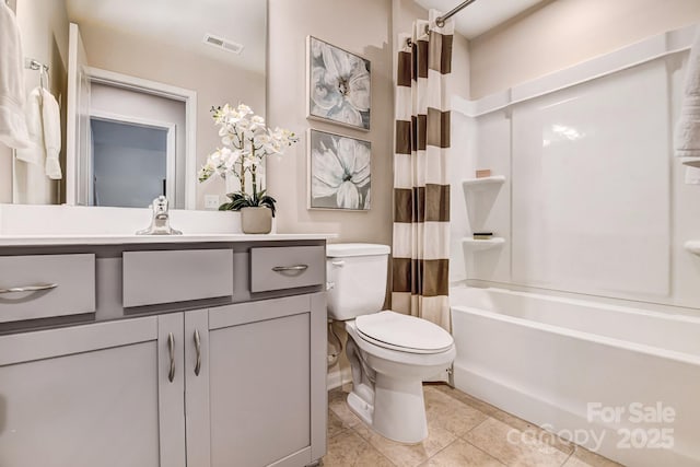 full bathroom with toilet, vanity, tile patterned floors, and shower / bath combo with shower curtain