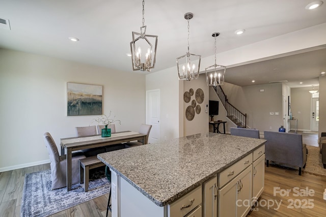 kitchen featuring a center island and light hardwood / wood-style floors