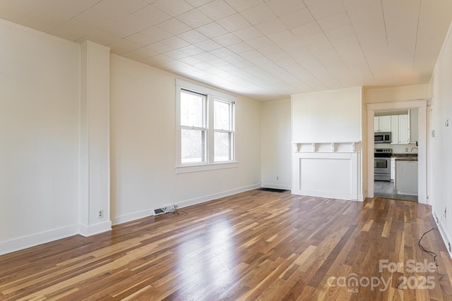 unfurnished living room featuring hardwood / wood-style flooring