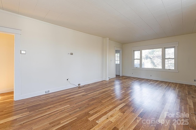 spare room featuring hardwood / wood-style flooring