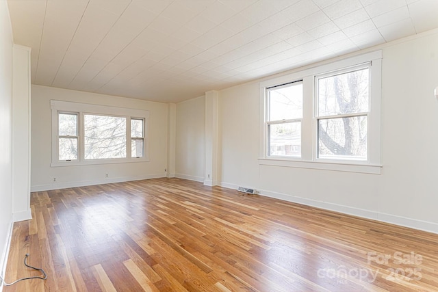 empty room with hardwood / wood-style flooring