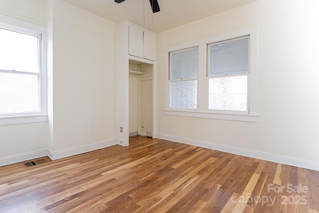 unfurnished bedroom featuring ceiling fan and light hardwood / wood-style floors