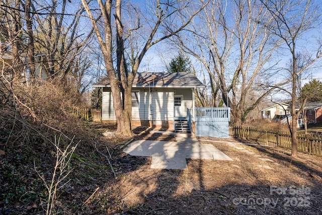 view of front of property featuring a wooden deck