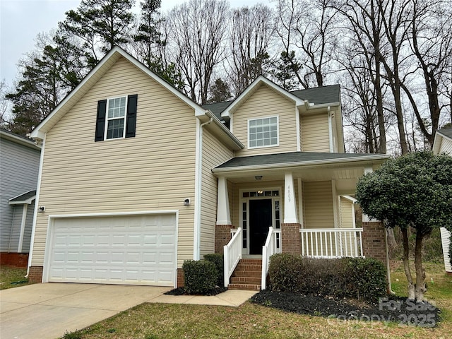 traditional-style home featuring a garage, a porch, and concrete driveway