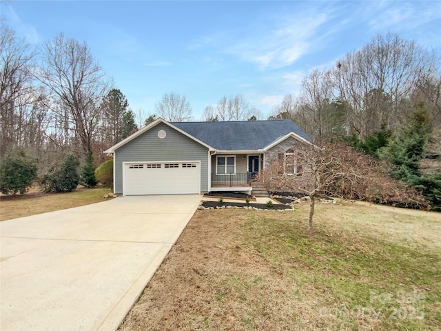 ranch-style house featuring a porch, a garage, and a front lawn