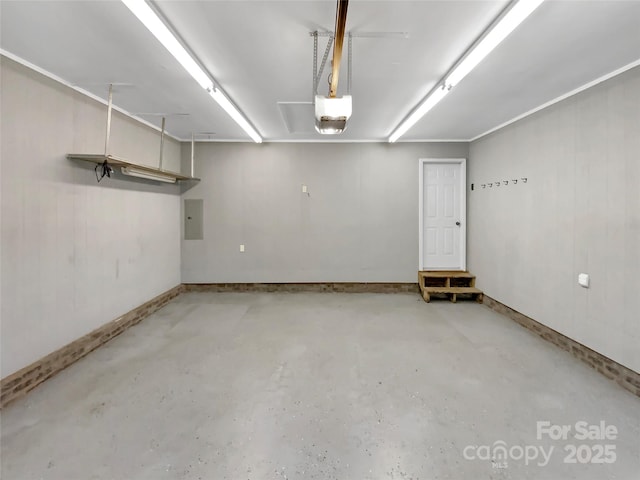 garage featuring a garage door opener and electric panel