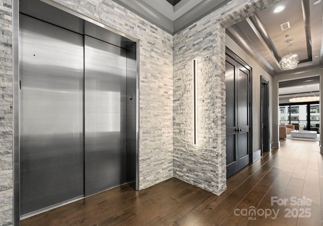 19329 Watermark Dr Unit 551/552, Cornelius, NC 28031 - hall featuring dark wood-type flooring, elevator, and a raised ceiling