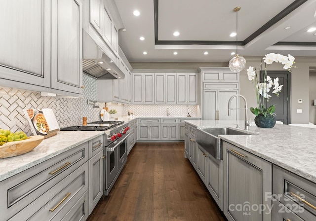 19329 Watermark Dr Unit 551/552, Cornelius, NC 28031 - kitchen with sink, gray cabinetry, a tray ceiling, light stone countertops, and range with two ovens