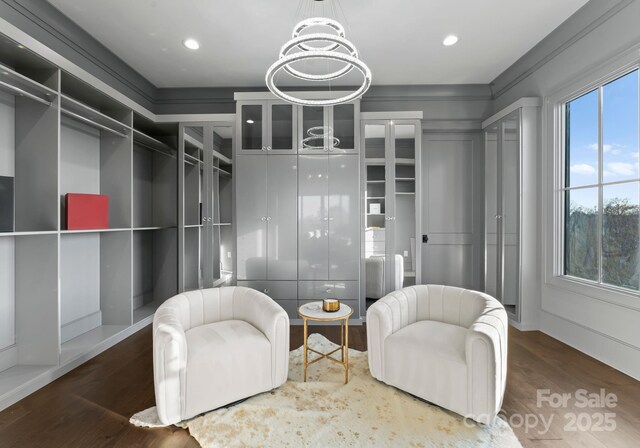19329 Watermark Dr Unit 551/552, Cornelius, NC 28031 - walk in closet featuring wood-type flooring and a chandelier