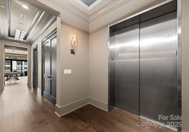 19329 Watermark Dr Unit 551/552, Cornelius, NC 28031 - hall featuring wood-type flooring, ornamental molding, elevator, and a tray ceiling