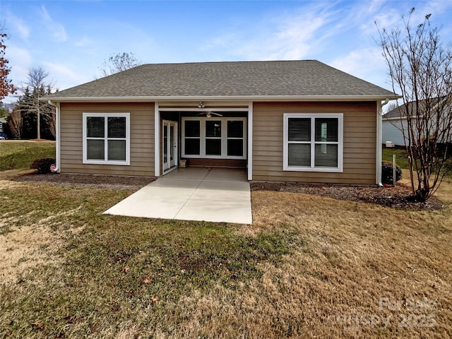 back of property featuring a yard, a patio, and ceiling fan