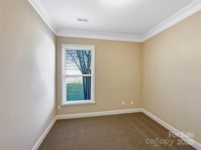 carpeted empty room featuring ornamental molding