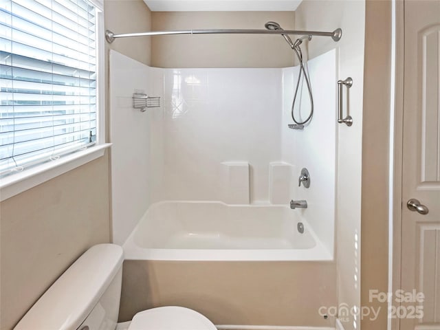 bathroom featuring  shower combination and toilet