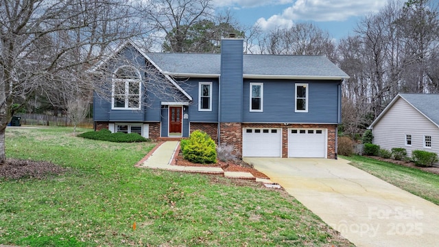 bi-level home with a garage and a front lawn