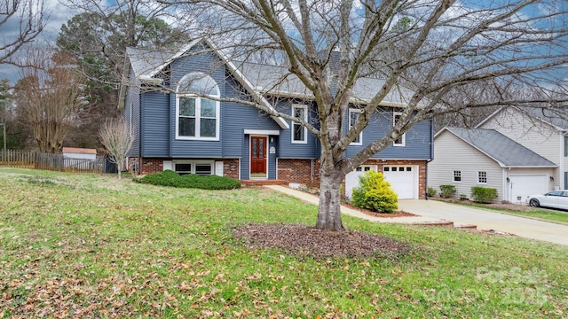 bi-level home with a garage and a front yard