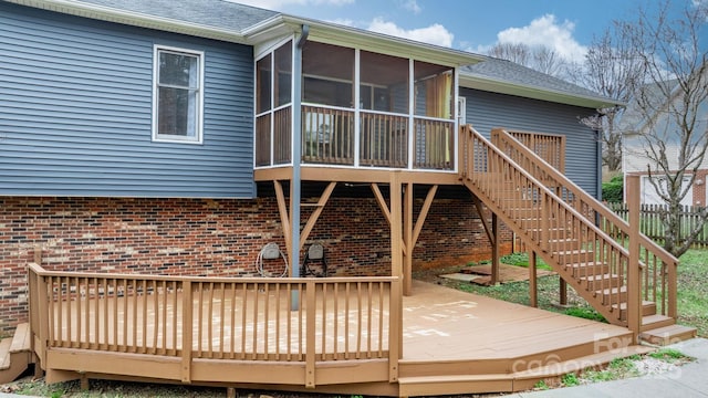 wooden deck featuring a sunroom