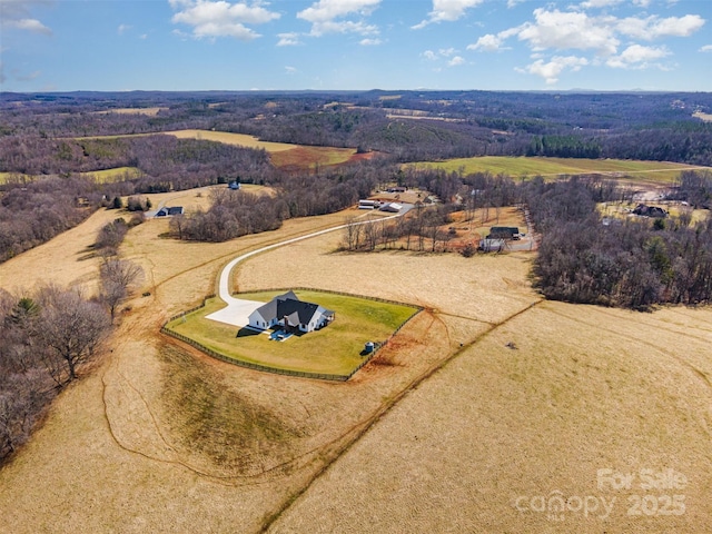 birds eye view of property featuring a rural view