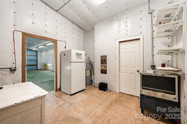 kitchen featuring white refrigerator and electric water heater