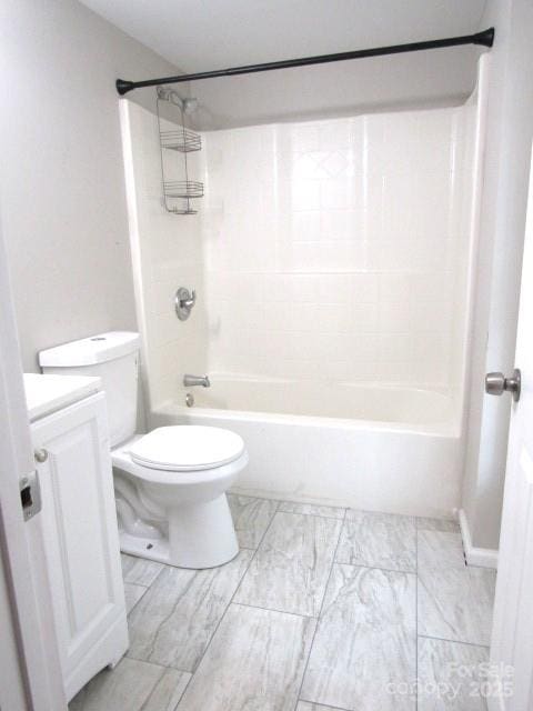 full bathroom featuring vanity, bathtub / shower combination, and toilet