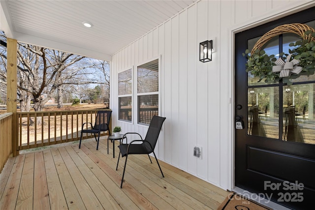 wooden deck featuring covered porch