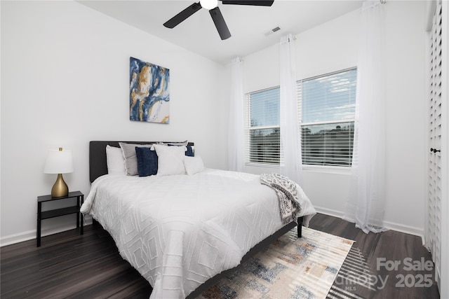 bedroom featuring dark hardwood / wood-style flooring and ceiling fan