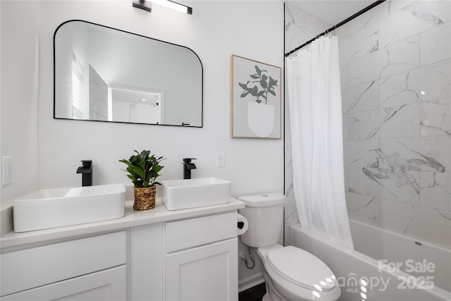 full bathroom featuring vanity, shower / tub combo with curtain, and toilet