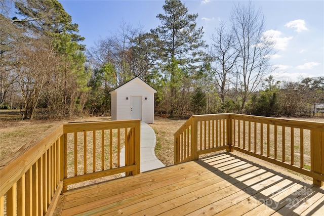 wooden terrace featuring a shed