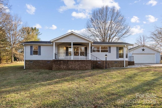 ranch-style house with an outbuilding, a porch, a garage, and a front yard