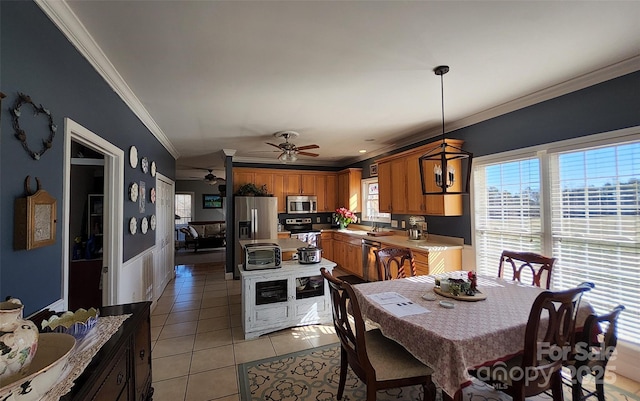 660 Scoggins Rd, Rutherfordton, NC 28139 - dining room with crown molding, light tile patterned floors, and a ceiling fan