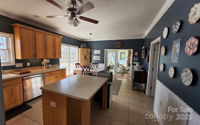 660 Scoggins Rd, Rutherfordton, NC 28139 - kitchen featuring dishwasher, a center island, a ceiling fan, light tile patterned flooring, and brown cabinets