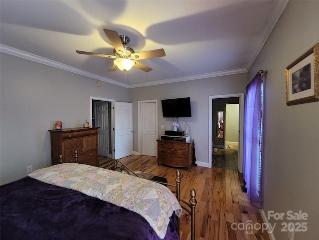 660 Scoggins Rd, Rutherfordton, NC 28139 - bedroom with wood finished floors, crown molding, and a ceiling fan