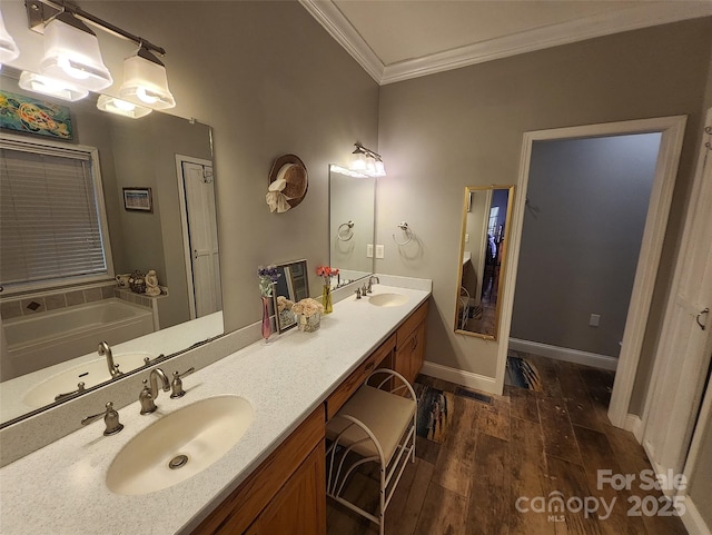 660 Scoggins Rd, Rutherfordton, NC 28139 - bathroom featuring crown molding, wood finished floors, double vanity, and a garden tub