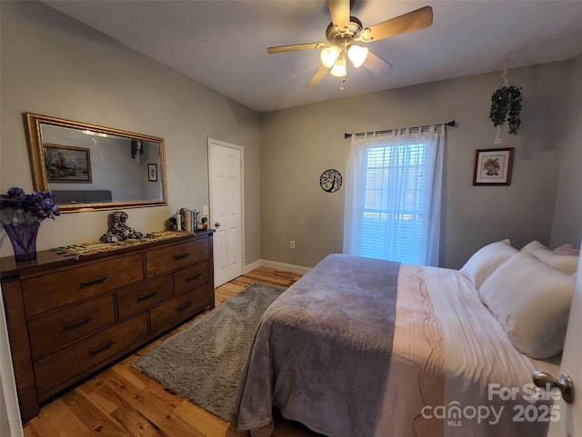 660 Scoggins Rd, Rutherfordton, NC 28139 - bedroom with light wood-type flooring, baseboards, and a ceiling fan