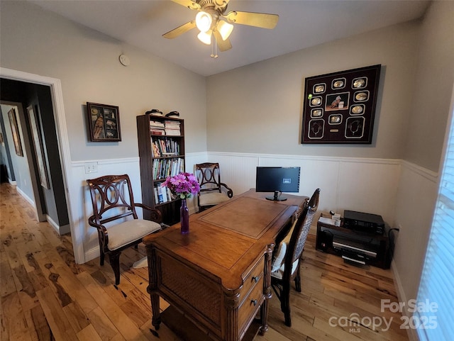 660 Scoggins Rd, Rutherfordton, NC 28139 - home office with a wainscoted wall, light wood finished floors, and ceiling fan