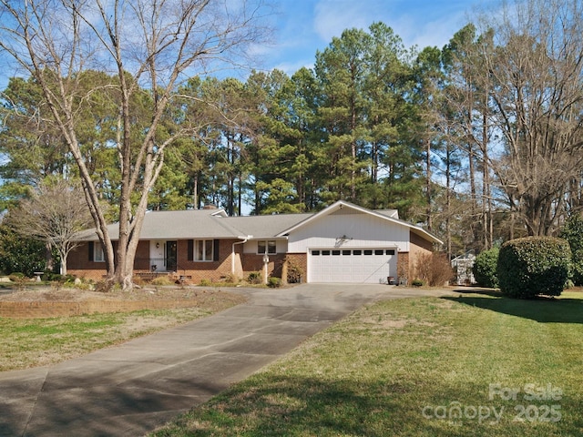 ranch-style home with a garage and a front lawn