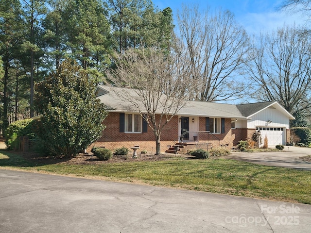 view of front of home with a garage and a front yard