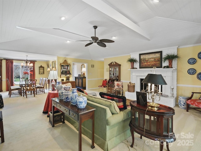 living room featuring crown molding, lofted ceiling, a fireplace, and light carpet