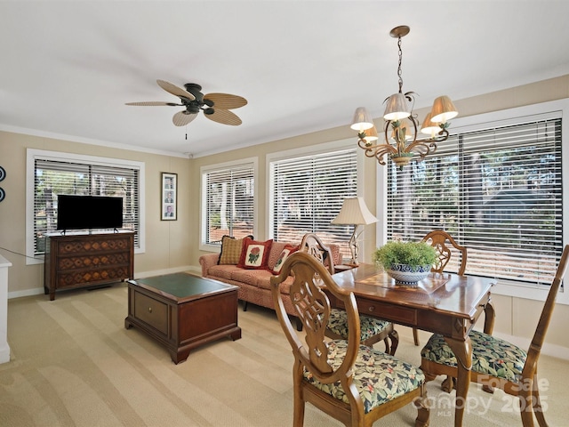 carpeted living room with ornamental molding, ceiling fan with notable chandelier, and a wealth of natural light