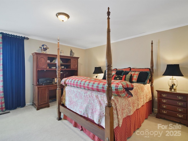 carpeted bedroom featuring crown molding