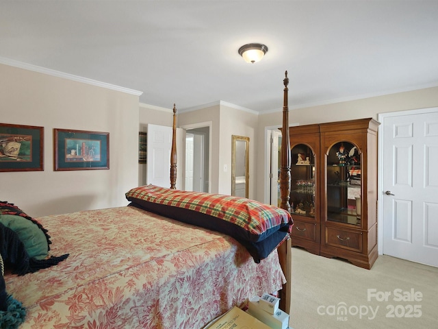 carpeted bedroom with ornamental molding