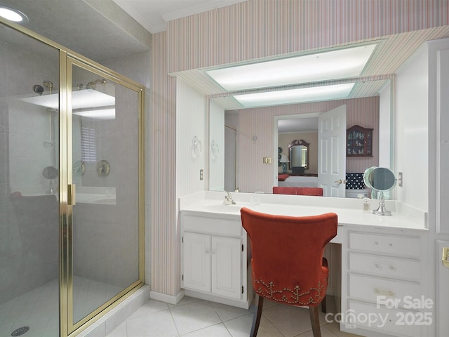 bathroom with vanity, a shower with shower door, and tile patterned floors