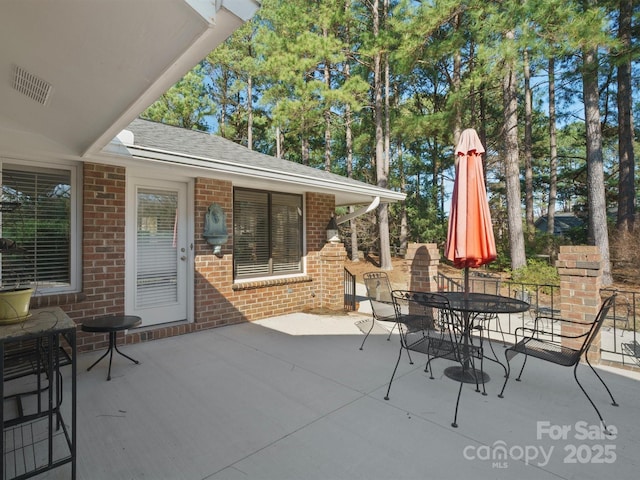 view of patio featuring a fireplace