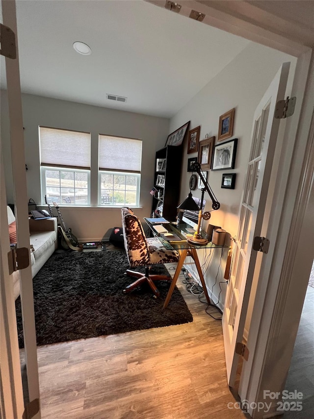 office space with light hardwood / wood-style floors