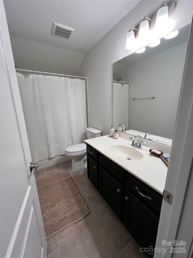 full bathroom with shower / bath combination with curtain, vanity, toilet, and tile patterned flooring