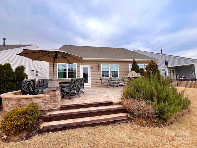 back of property with a patio